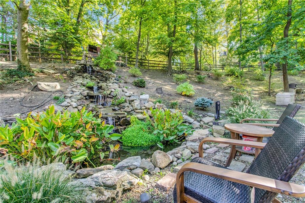 95 Woodland Road Pittsburgh, PA 15232 - Photo 24 of 25 There's nothing like the sound of a tranquil waterfall to sooth the senses and instill an instant sense of peace and calm...This beautifully crafted natural stone waterfall and koi pond were also part of the major exterior renovation project done by the current sellers.