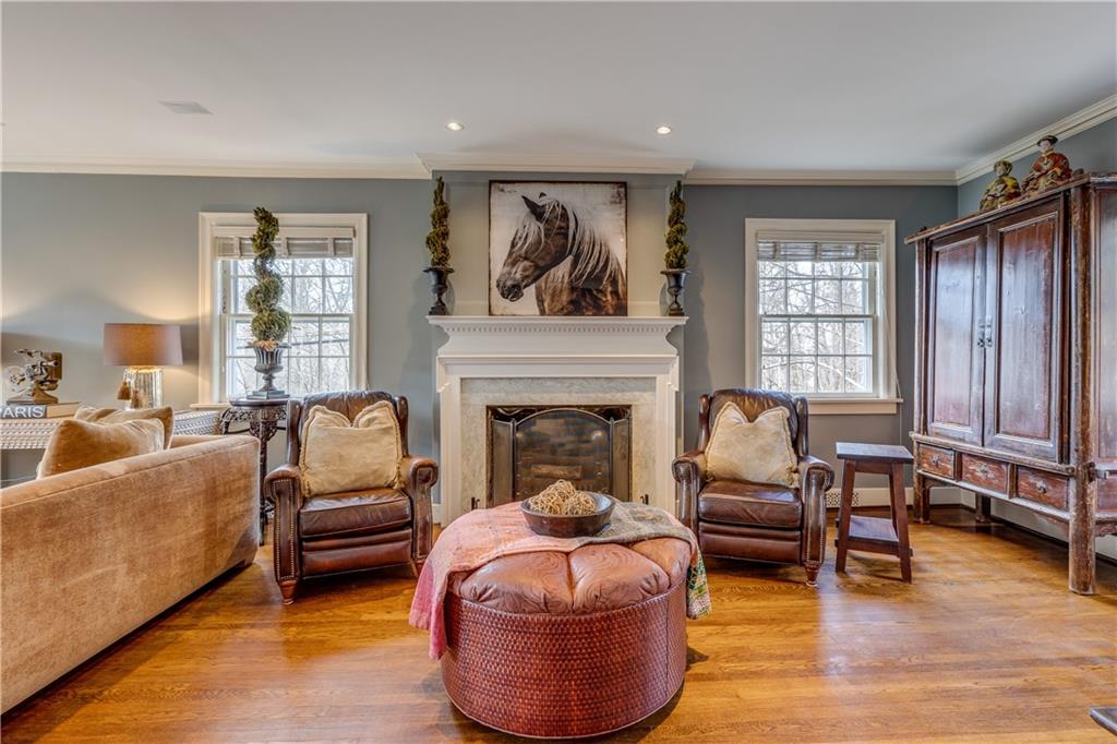 95 Woodland Road Pittsburgh, PA 15232 - Photo 5 of 25 The expansive living room is filled with lots of natural light from the walls of windows. The fireplace adds to the appeal of this inviting space...
