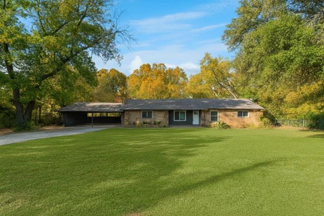 312 Old Justin Road Argyle, TX 76226 - Photo 1 of 24 a front view of a house with a garden