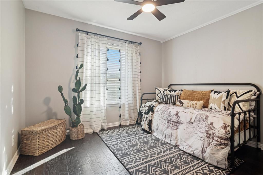 312 Old Justin Road Argyle, TX 76226 - Photo 15 of 24 a bedroom with bed and wooden floor