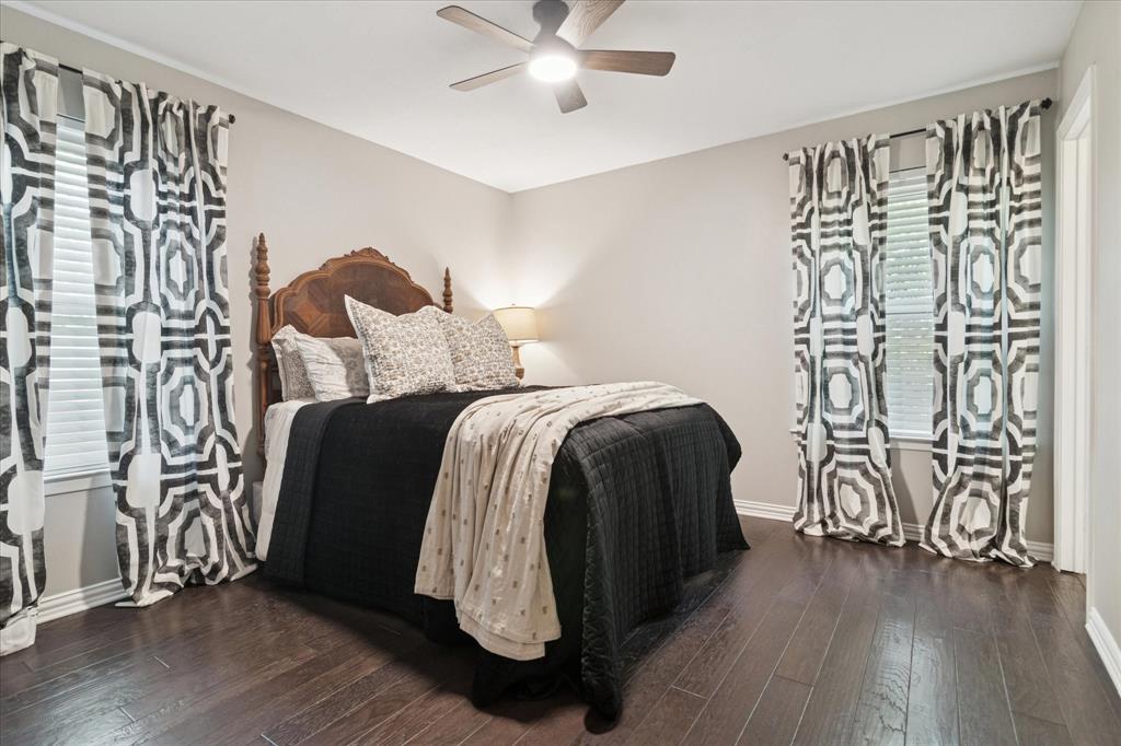 312 Old Justin Road Argyle, TX 76226 - Photo 17 of 24 a bedroom with a bed and wooden floor