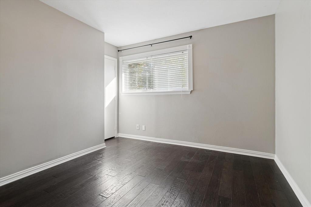 312 Old Justin Road Argyle, TX 76226 - Photo 18 of 24 a view of an empty room with wooden floor and a window