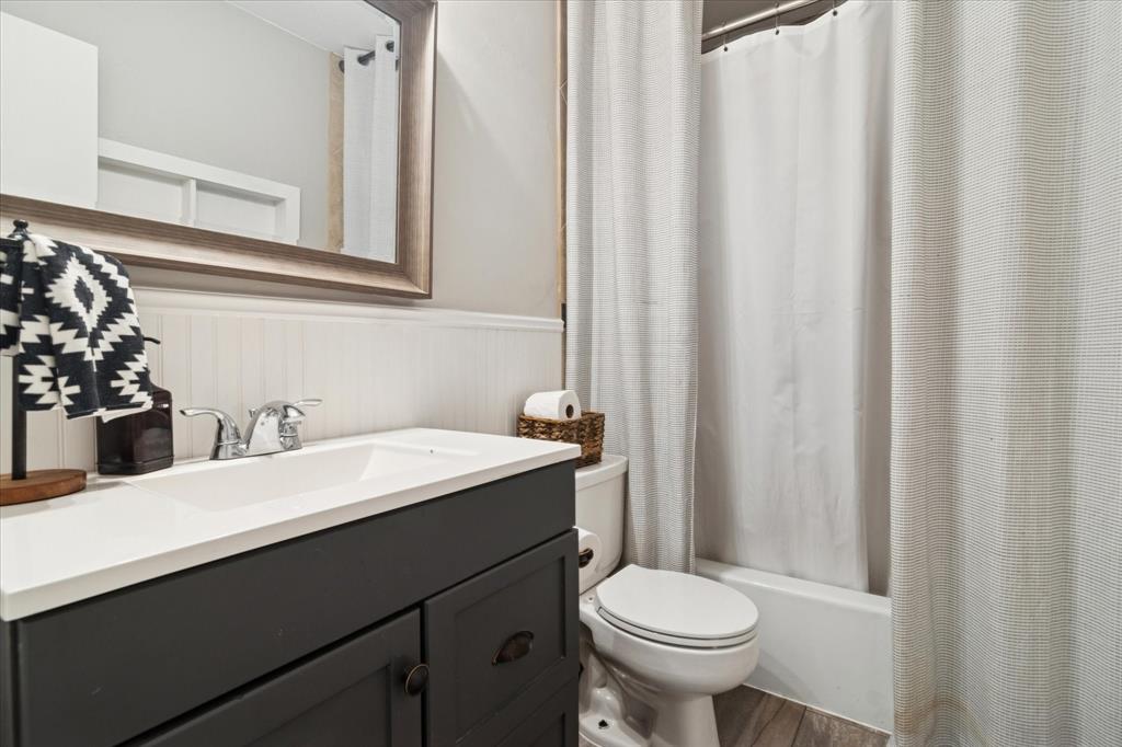 312 Old Justin Road Argyle, TX 76226 - Photo 19 of 24 a bathroom with a sink a toilet and a mirror