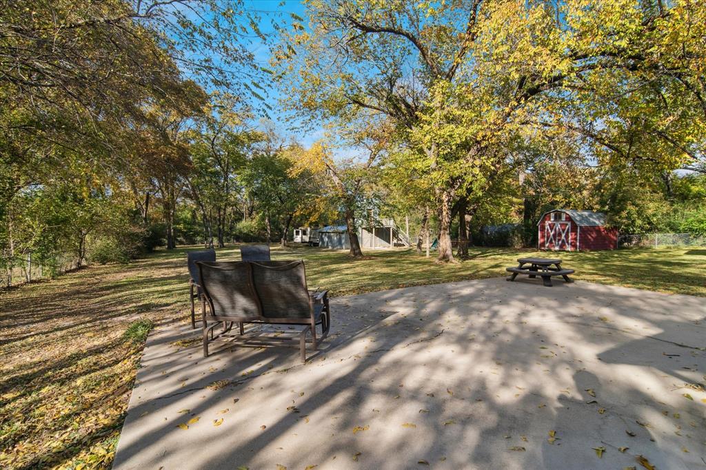 312 Old Justin Road Argyle, TX 76226 - Photo 23 of 24 a view of a bench in a yard