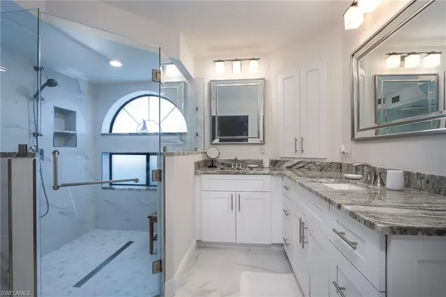 a bedroom with two beds and a window