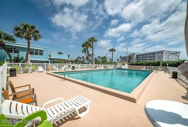 a view of swimming pool from a lake