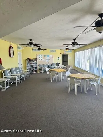 a room with lots of table and chairs