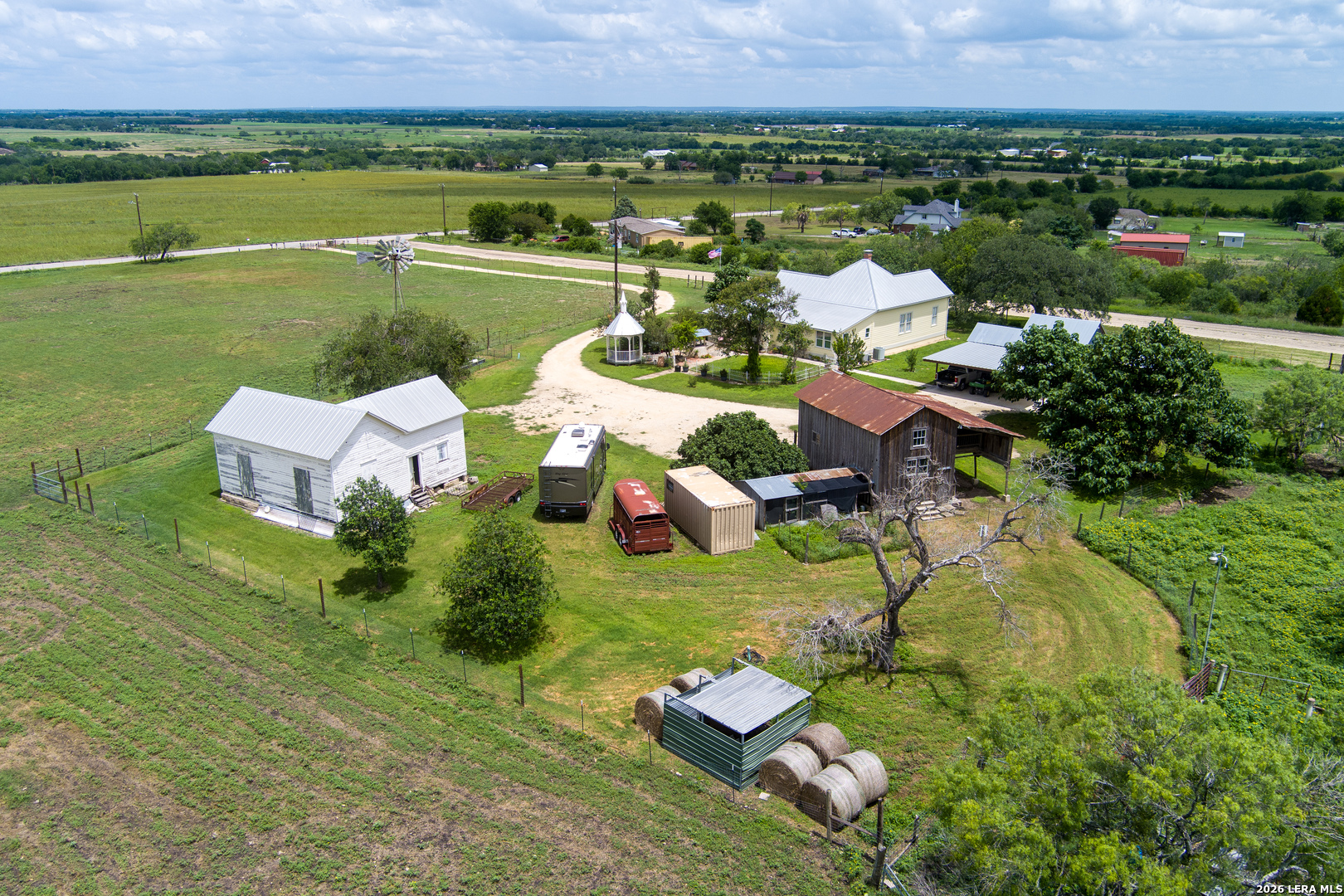 4515 Stapper Road St. Hedwig, TX 78152 - Photo 55 of 64 a view of a lake with a yard and a fountain