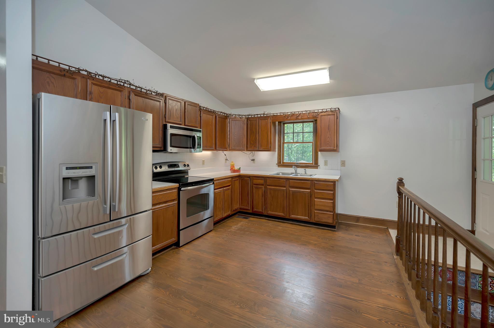 10165 Meadows Road Locust Grove, VA 22508 - Photo 10 of 52 Comact & Efficient Kitchen ; stairwell to basement