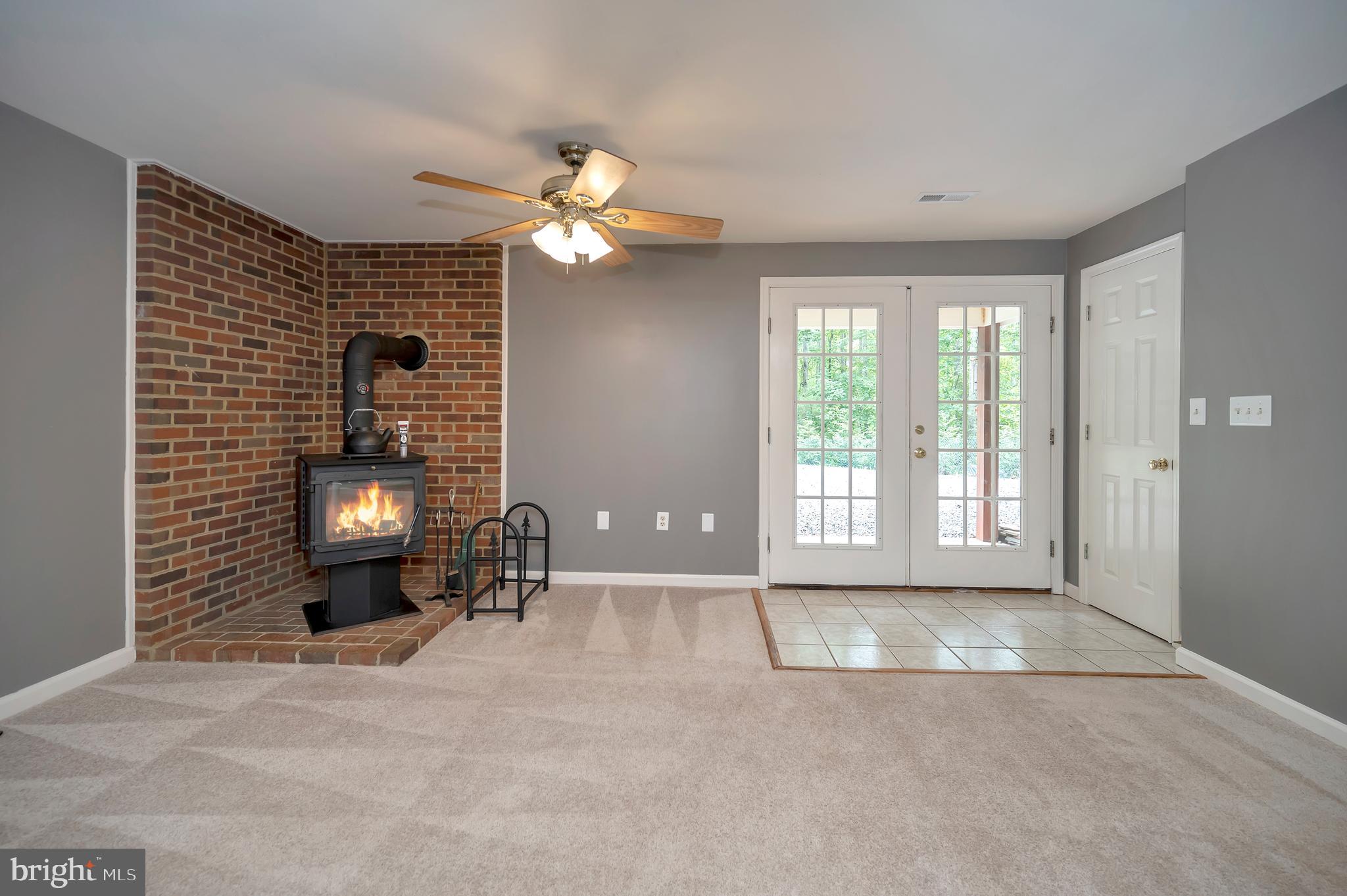 10165 Meadows Road Locust Grove, VA 22508 - Photo 26 of 52 corner stove & slider to patio