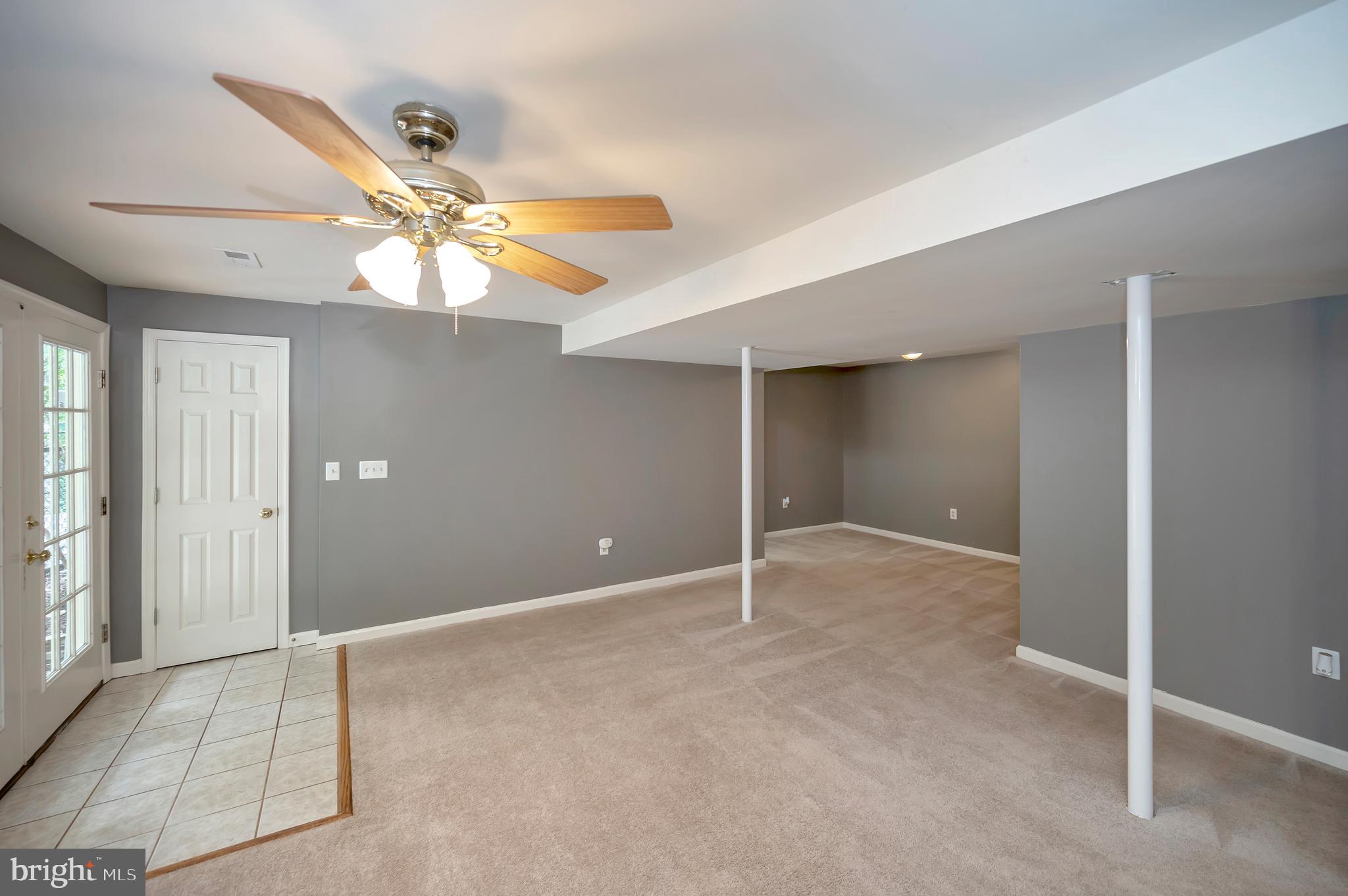 10165 Meadows Road Locust Grove, VA 22508 - Photo 27 of 52 fam rm shows access to backyard door foyer