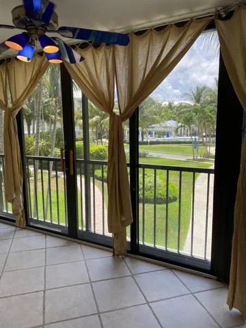 a view of an empty room with a fireplace