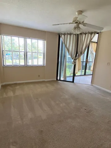 a view of an empty room with a window