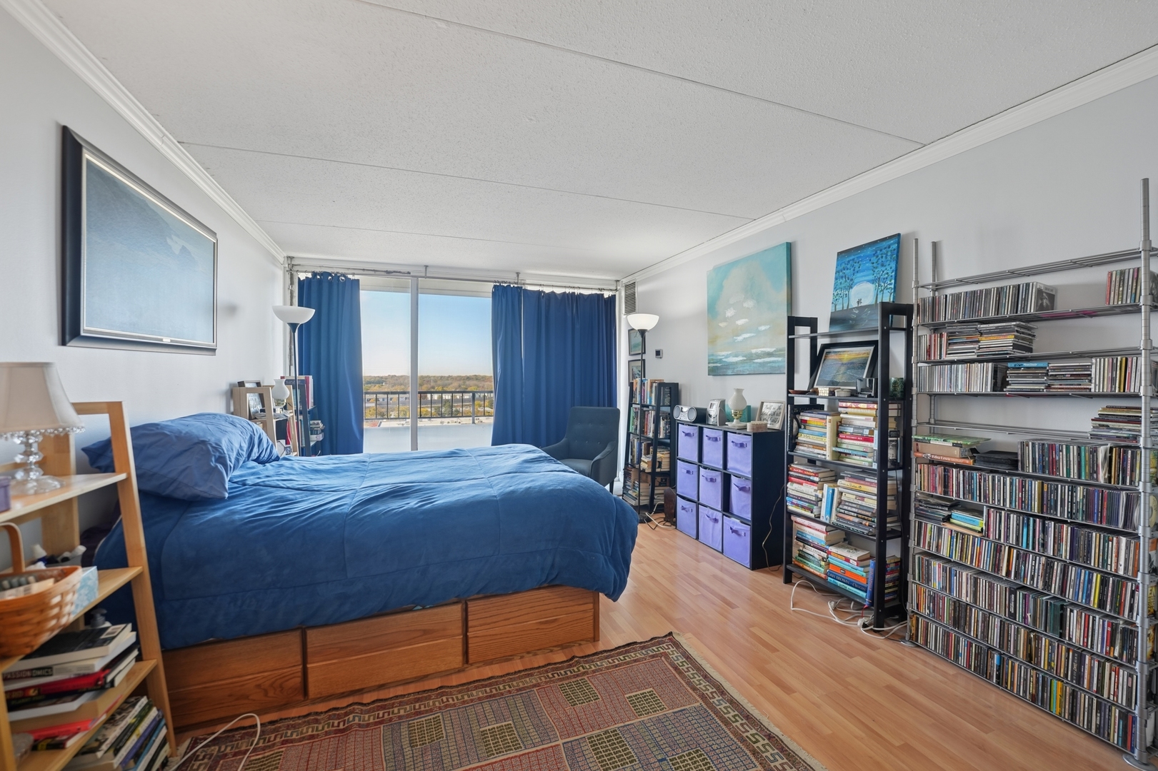 2005 South Finley Road, Unit 1202 Lombard, IL 60148 - Photo 18 of 29 a bed room with a bed and a book shelf