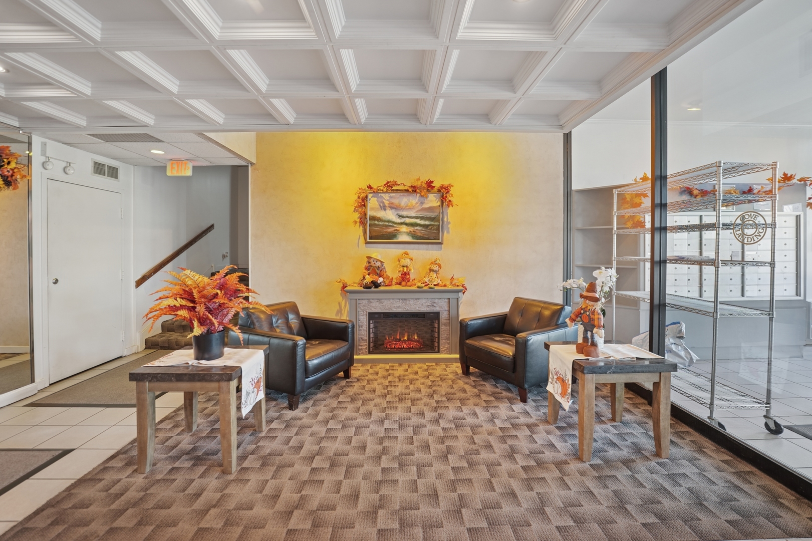 2005 South Finley Road, Unit 1202 Lombard, IL 60148 - Photo 4 of 29 a living room with furniture and a flat screen tv