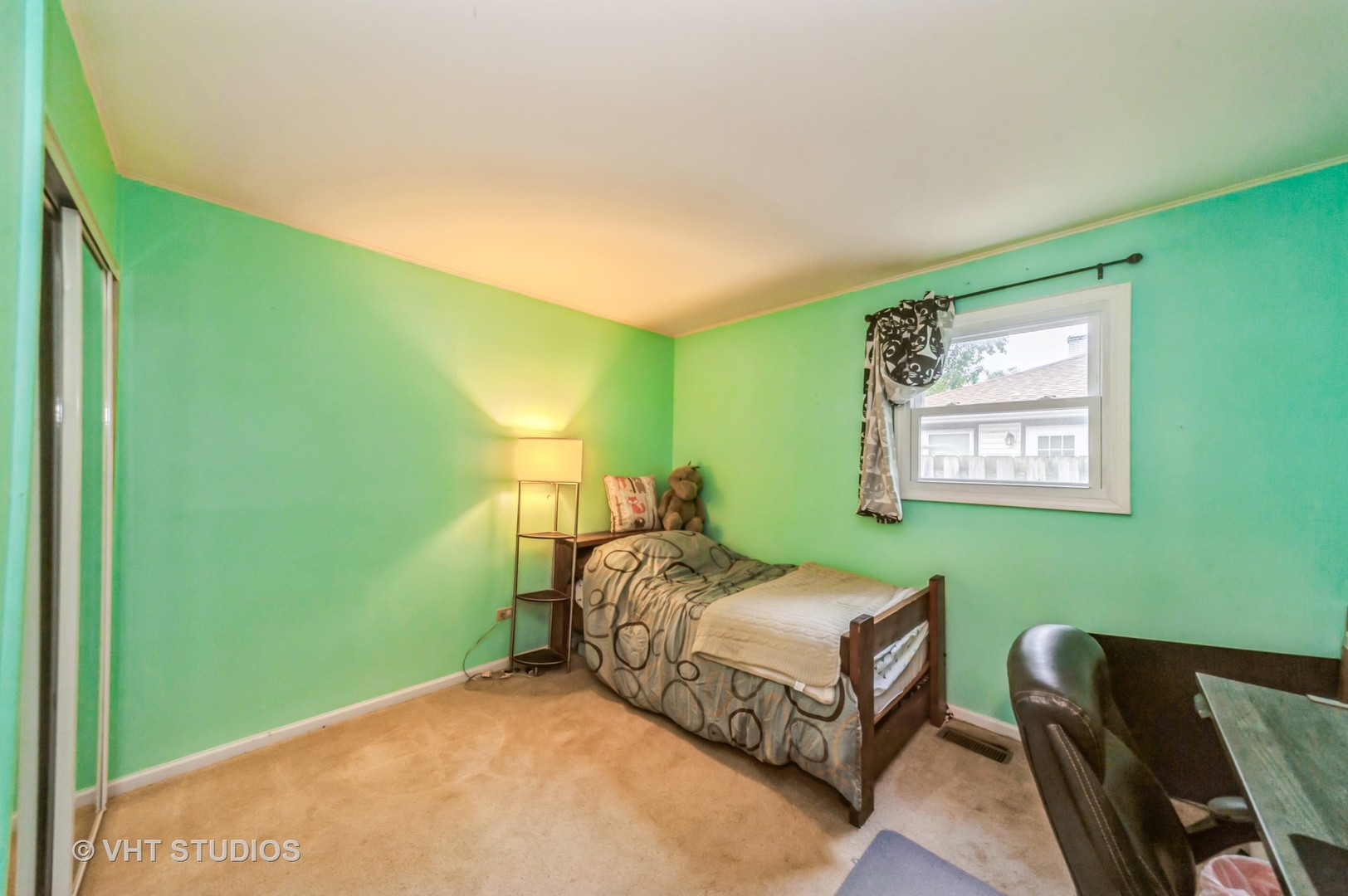 3700 Holly Lane Rolling Meadows, IL 60008 - Photo 11 of 13 a bedroom with a bed and a window