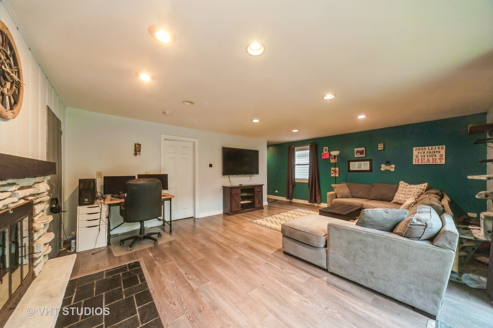 3700 Holly Lane Rolling Meadows, IL 60008 - Photo 5 of 13 a living room with furniture a fireplace and a flat screen tv