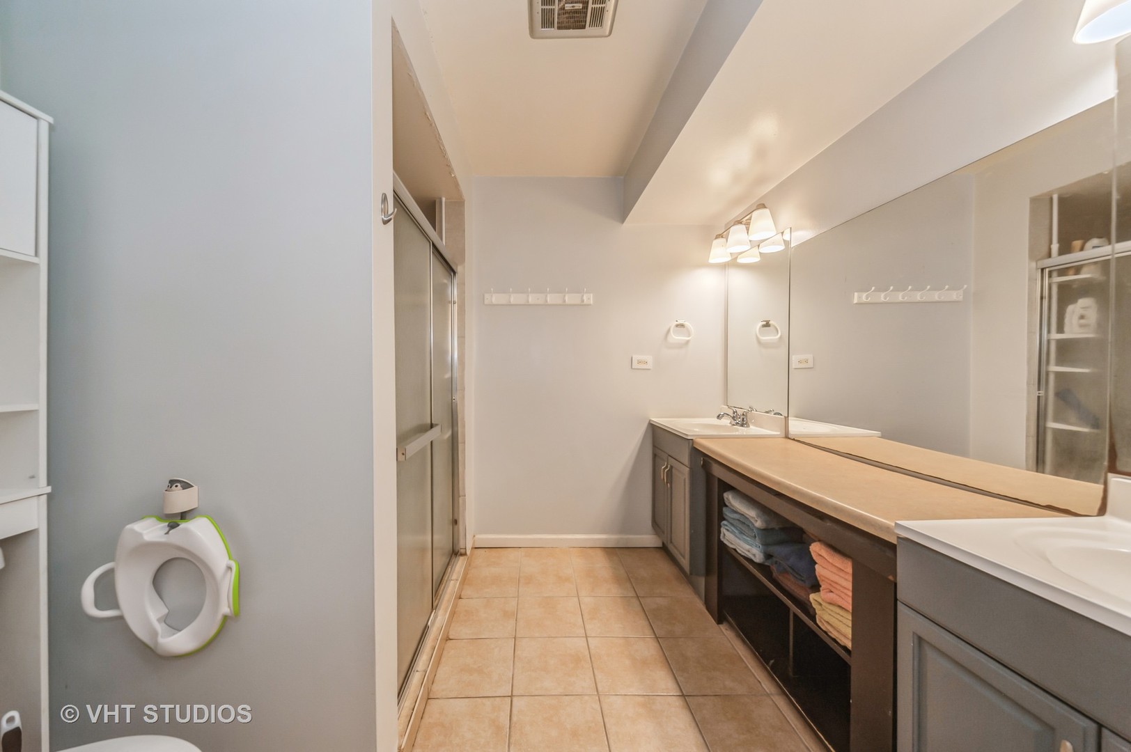 3700 Holly Lane Rolling Meadows, IL 60008 - Photo 9 of 13 a spacious bathroom with a granite countertop sink and a mirror