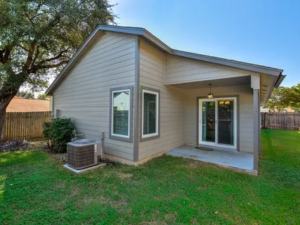 a view of a house with a yard and plants