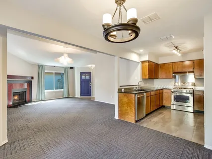 a view of a kitchen with a sink and microwave