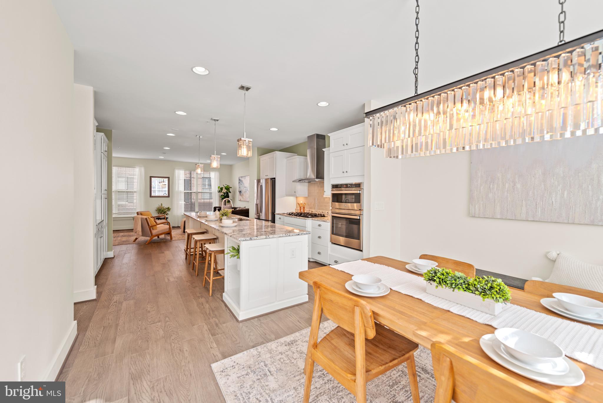 502 Windboard Way Oxon Hill, MD 20745 - Photo 14 of 54 a living room with dining room and wooden floor