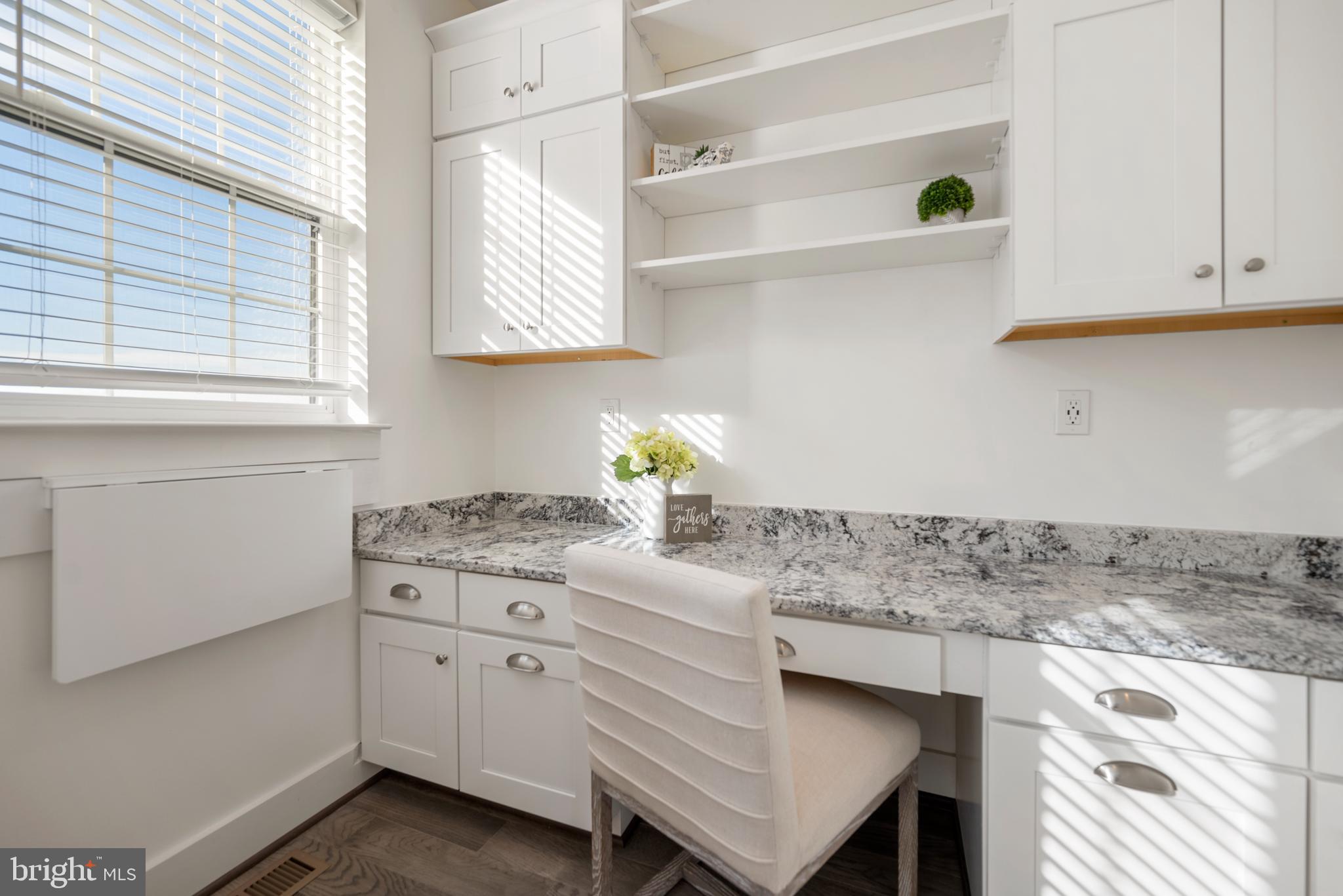 502 Windboard Way Oxon Hill, MD 20745 - Photo 16 of 54 a kitchen with white cabinets and window