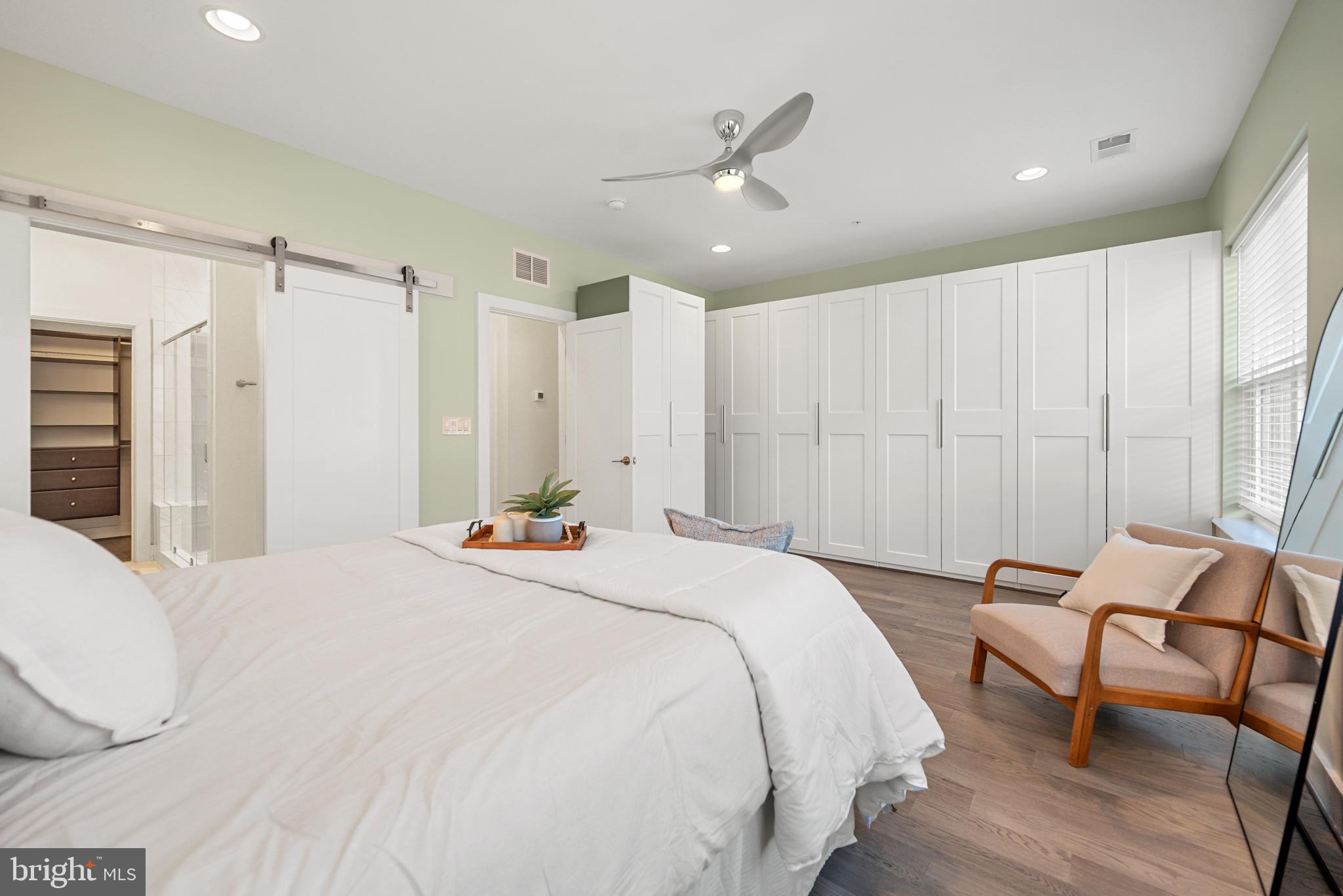 502 Windboard Way Oxon Hill, MD 20745 - Photo 21 of 54 a spacious bedroom with a bed and a table