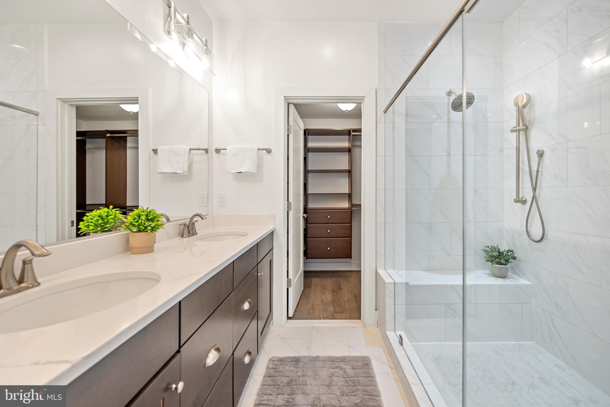 502 Windboard Way Oxon Hill, MD 20745 - Photo 22 of 54 a bathroom with a shower sink and mirror