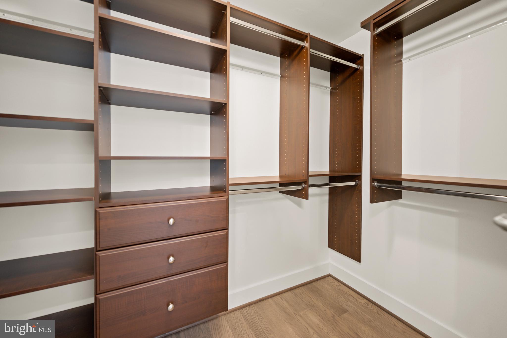 502 Windboard Way Oxon Hill, MD 20745 - Photo 23 of 54 a view of walk in closet with empty racks