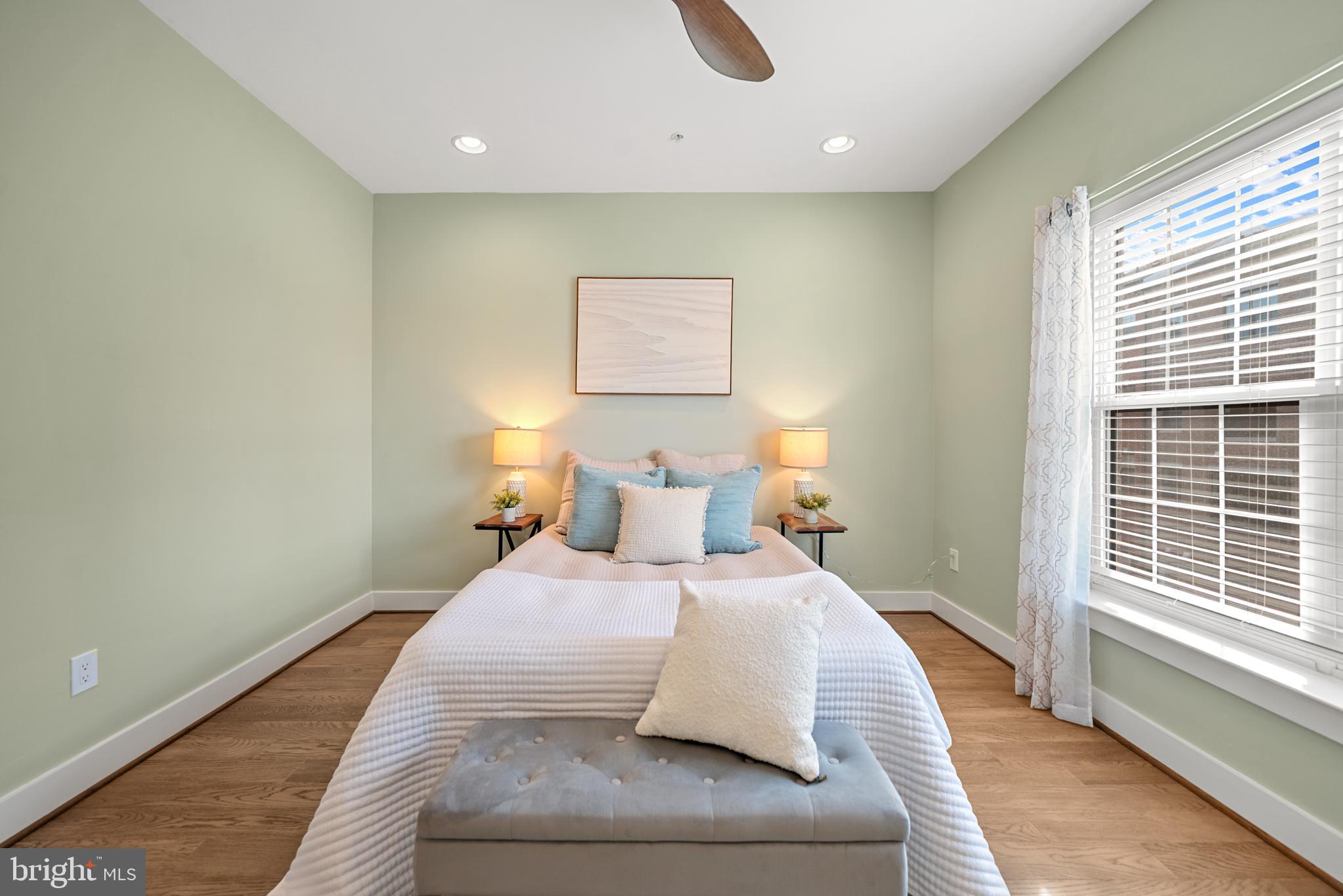 502 Windboard Way Oxon Hill, MD 20745 - Photo 25 of 54 a bedroom with a bed and wooden floor