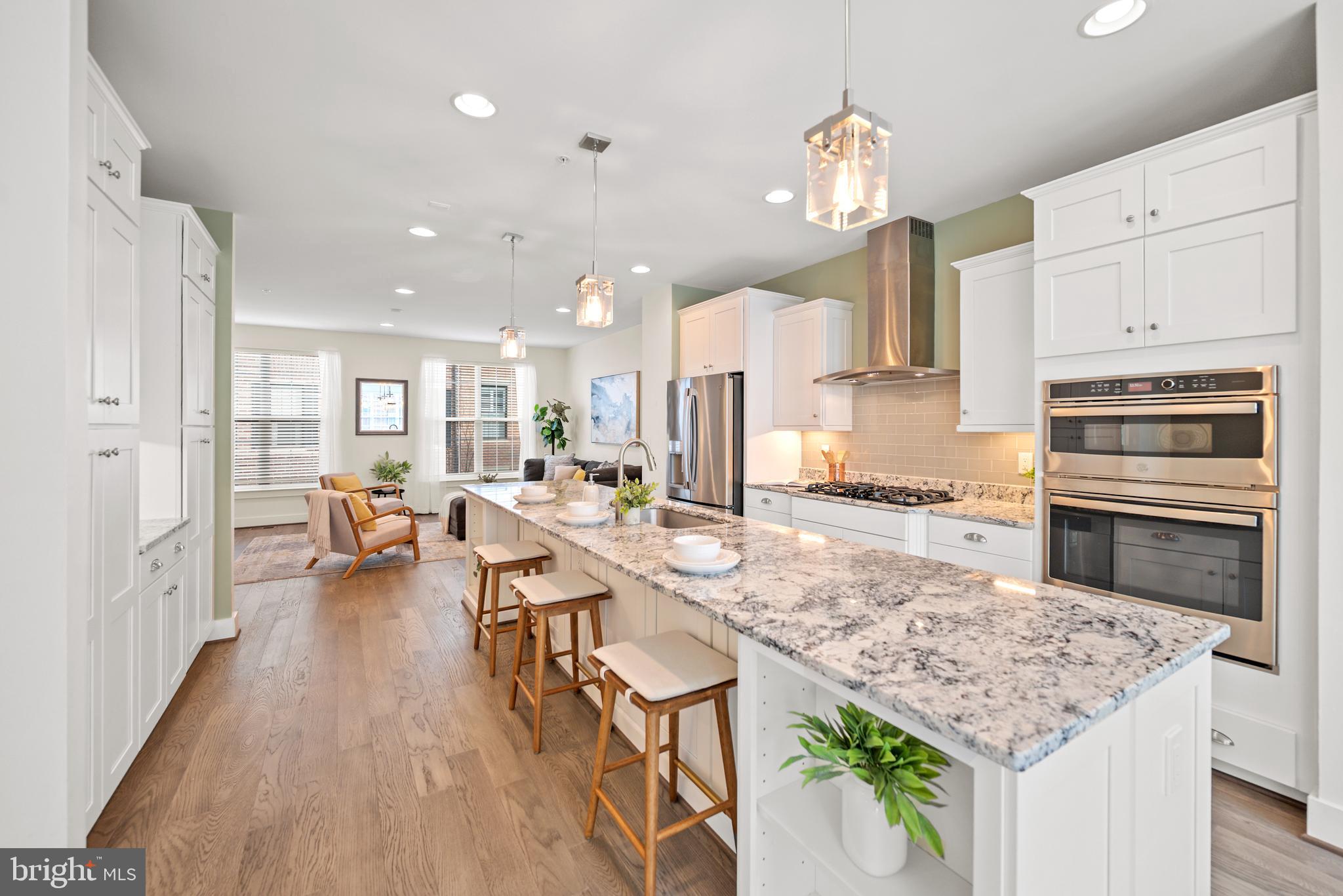 502 Windboard Way Oxon Hill, MD 20745 - Photo 3 of 54 a large kitchen with kitchen island a large counter space and stainless steel appliances