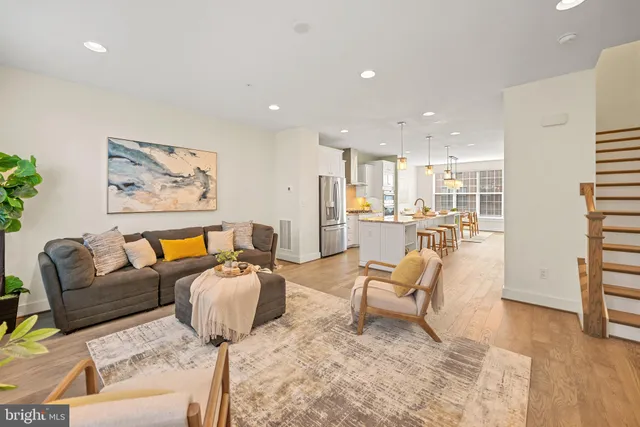 a living room with furniture and a rug