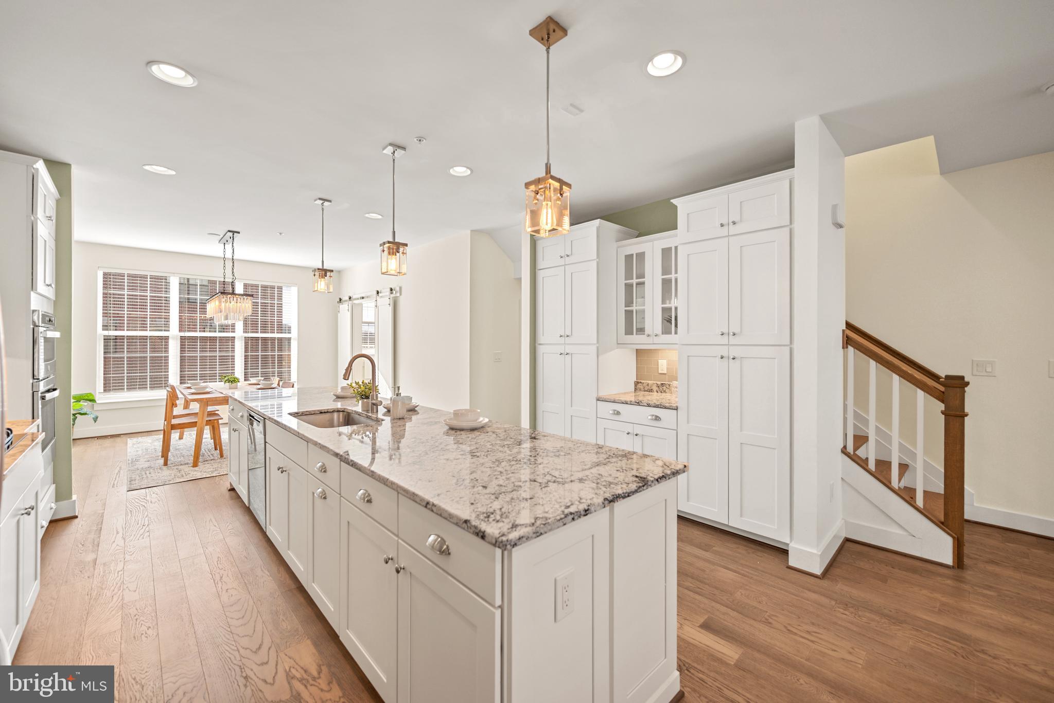 502 Windboard Way Oxon Hill, MD 20745 - Photo 10 of 54 a large white kitchen with a large window and stainless steel appliances
