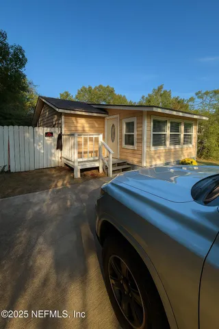 a front view of a house with parking space