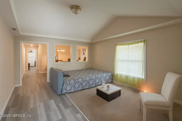 a living room with furniture and a rug