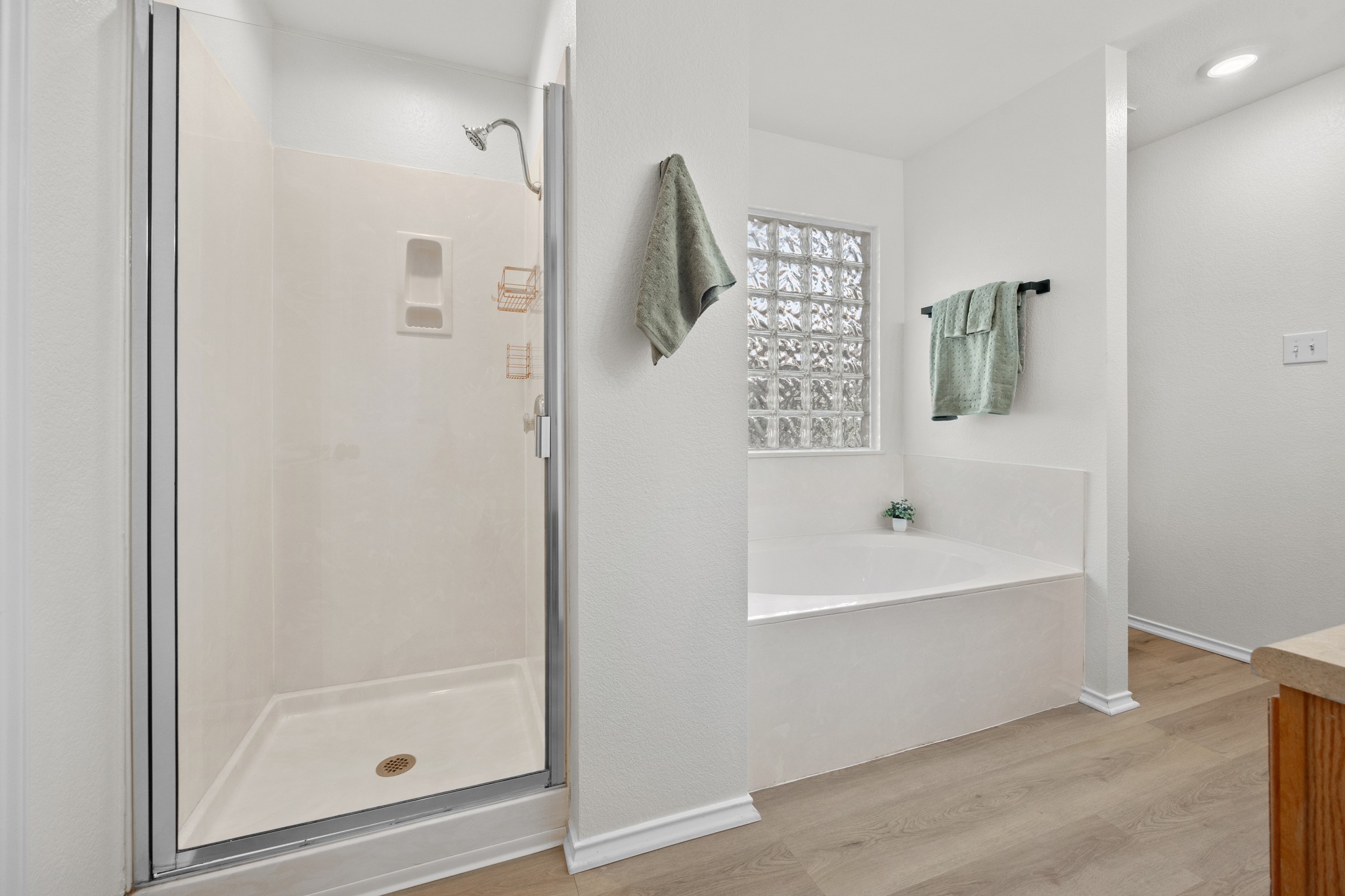 1818 Lost Maples Loop Cedar Park, TX 78613 - Photo 19 of 38 Indulge in relaxation with this serene bathroom, featuring a separate shower and a built-in soaking tub.