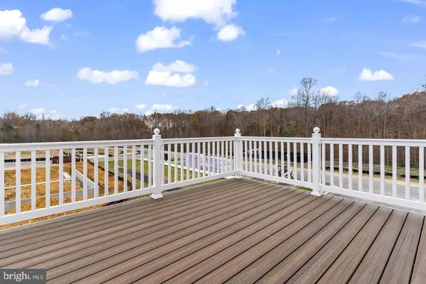 a view of a balcony with wooden floor