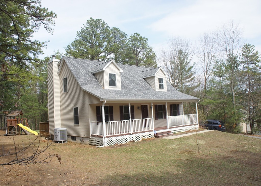 176 Palmer Road Brimfield, MA 01010 - Photo 1 of 17 a big white house with large windows and a large tree with large windows