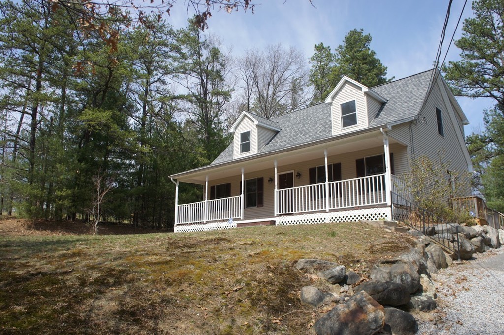 176 Palmer Road Brimfield, MA 01010 - Photo 2 of 17 a view of a house with a yard