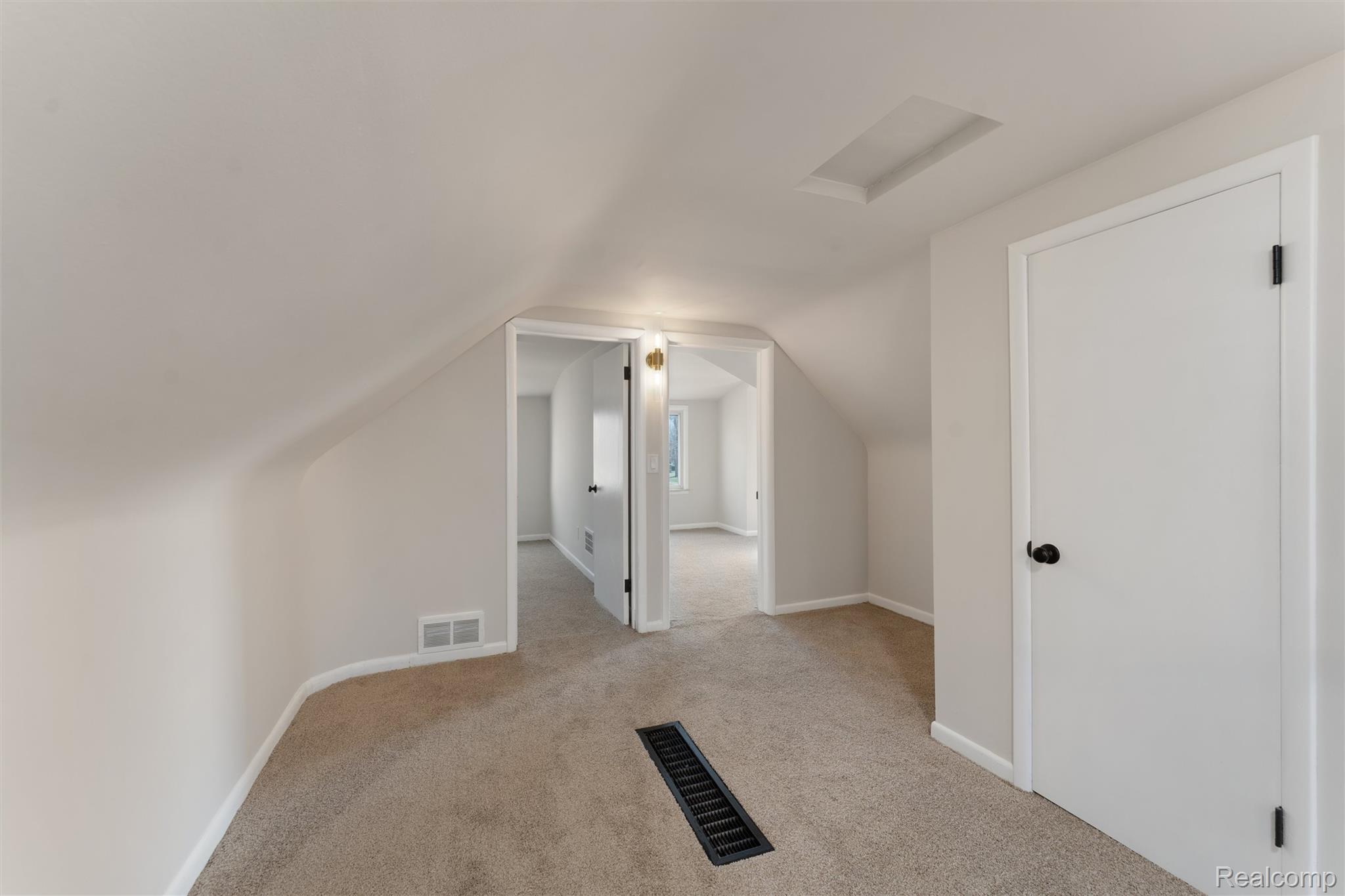 917 Perry Street Pontiac, MI 48340 - Photo 24 of 37 Additional living space with attic access and light carpet