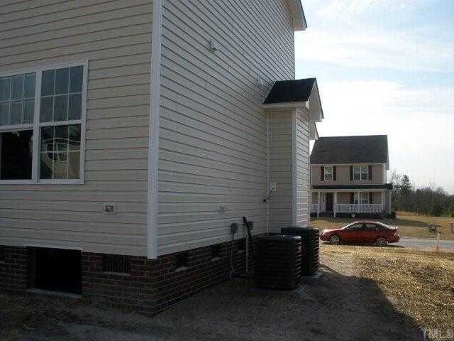 572 Rockingham Street Spring Lake, NC 28390 - Photo 2 of 12 a front view of a house with a yard