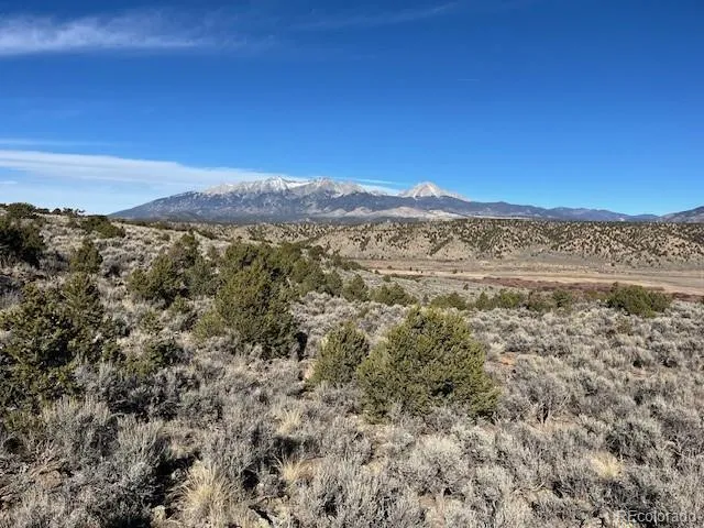 a view of a city with mountains in the background