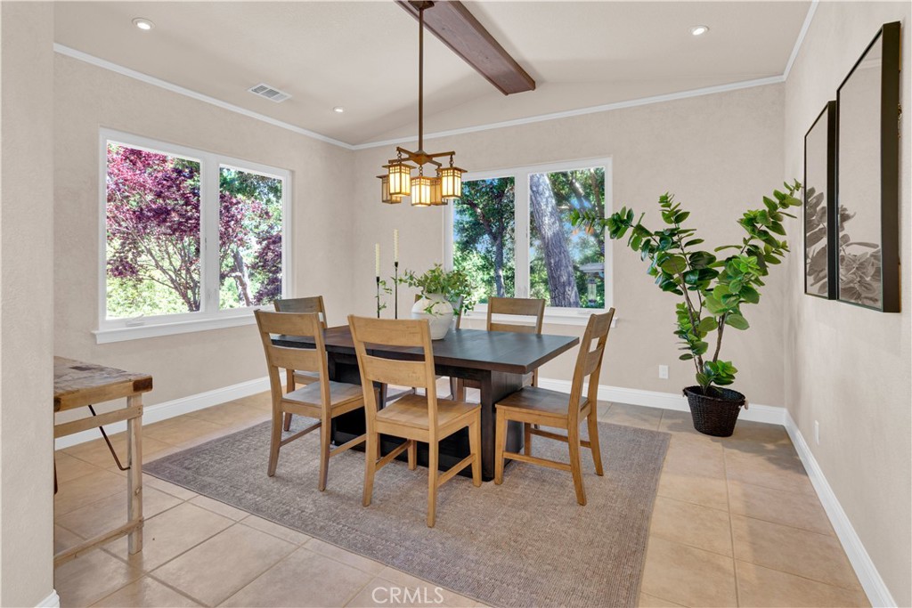 117 Frontier Way Templeton, CA 93465 - Photo 22 of 57 a dining room with furniture potted plants and wooden floor