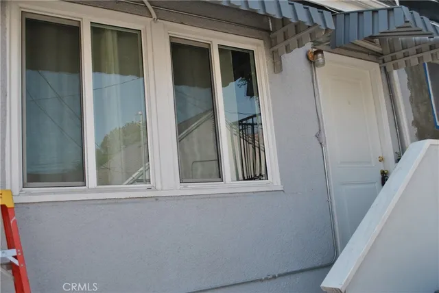 a view of a door and a window