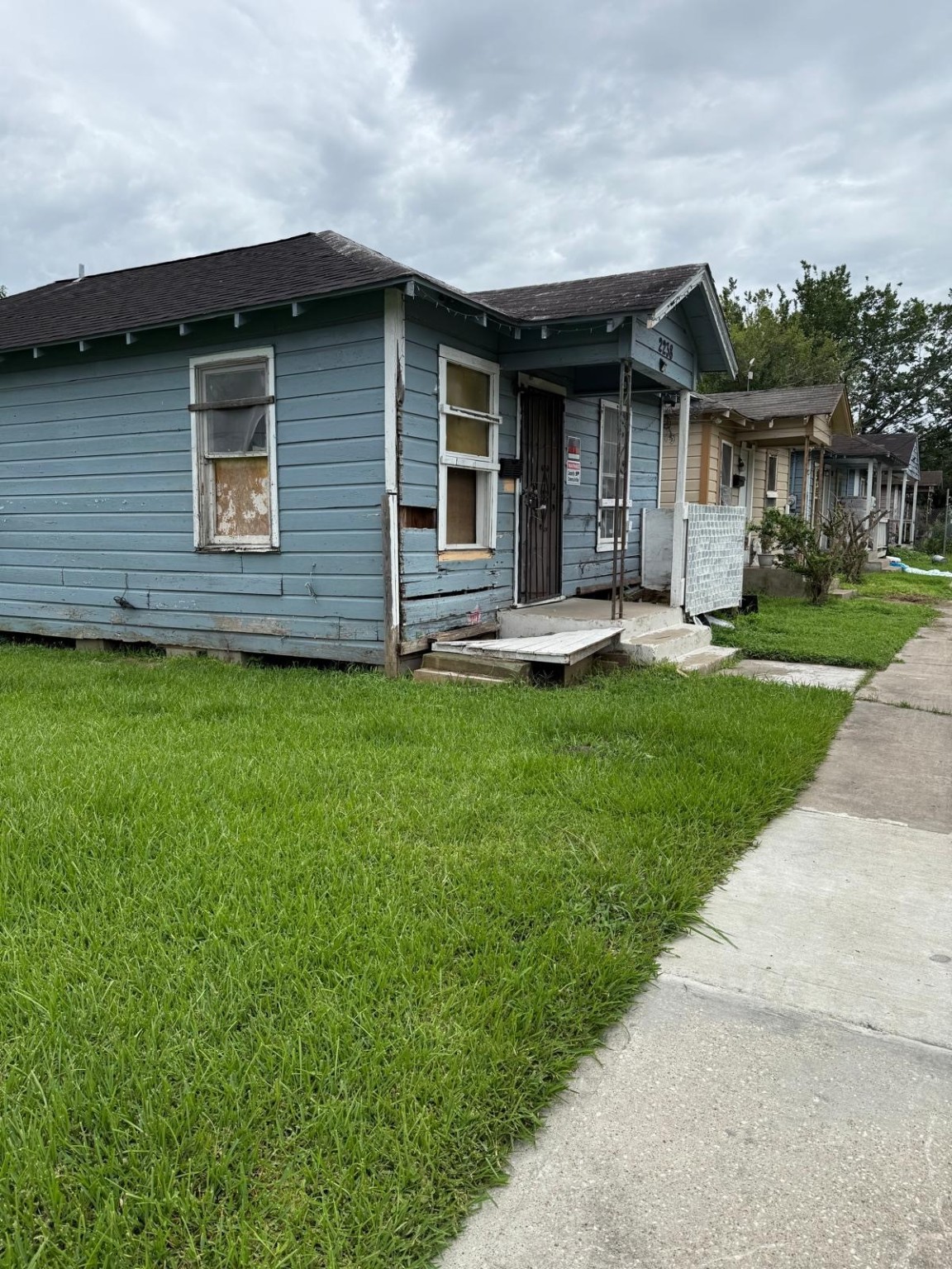 2238 Hutton Street Houston, TX 77026 - Photo 2 of 10 a front view of a house with a yard and garage