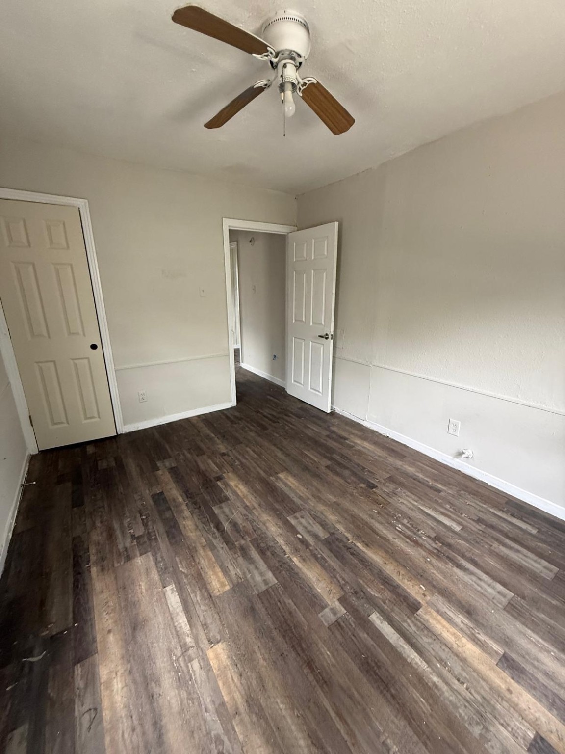 2238 Hutton Street Houston, TX 77026 - Photo 5 of 10 a view of an empty room with wooden floor ceiling fan