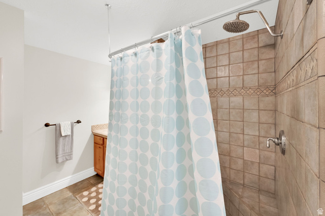 1506 Lakeview Drive Bountiful, UT 84010 - Photo 27 of 58 Bathroom featuring vanity, a shower stall, and light tile patterned floors