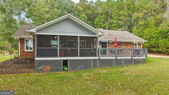 a view of a swimming pool with a yard