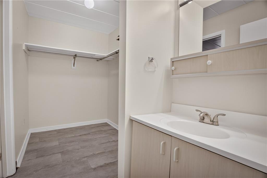 5 Bayard Road, Unit 309 Pittsburgh, PA 15213 - Photo 22 of 42 A bathroom with ample storage combines functionality with aesthetic appeal, offering organized spaces for toiletries, linens, and personal items while maintaining a clean and inviting atmosphere.