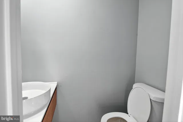 a bathroom with a toilet and sink